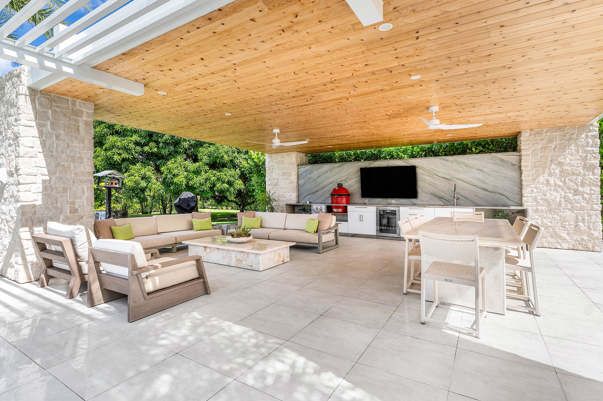 Covered pavilion with outdoor kitchen, kamado grill, and lounge